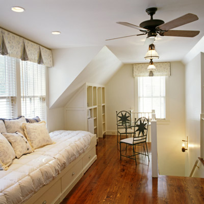 room with day bed window seat and ceiling fan