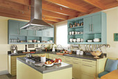 green kitchen with open shelving