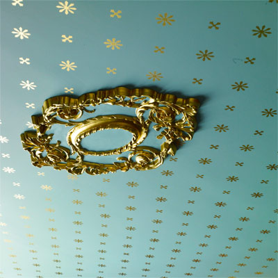 ceiling of 1879 parlor with paint stenciling to look like period wallpaper