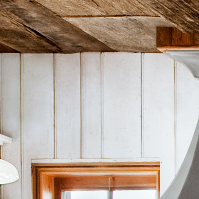 coastal cottage kitchen with close up of white beadboard walls