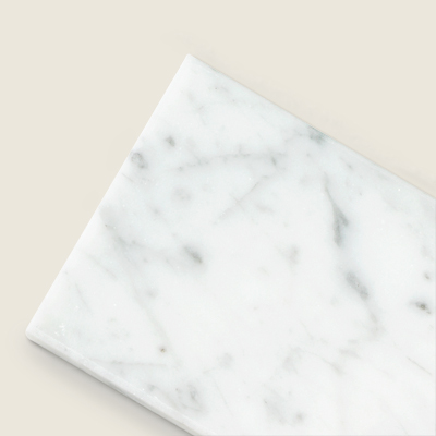 subway tile in Carrara marble 
