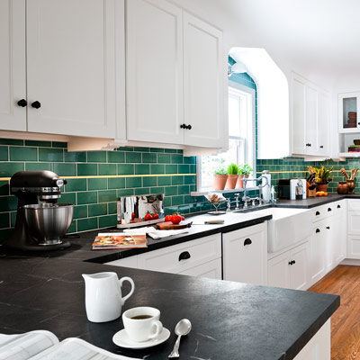 kitchen with white cabinets and green ceramic subway tile with running bond staggered pattern 