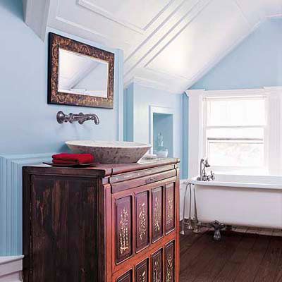 bathroom with antique sink cabinet and soaking tub