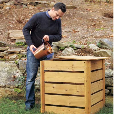 man pouring compost into compost bin