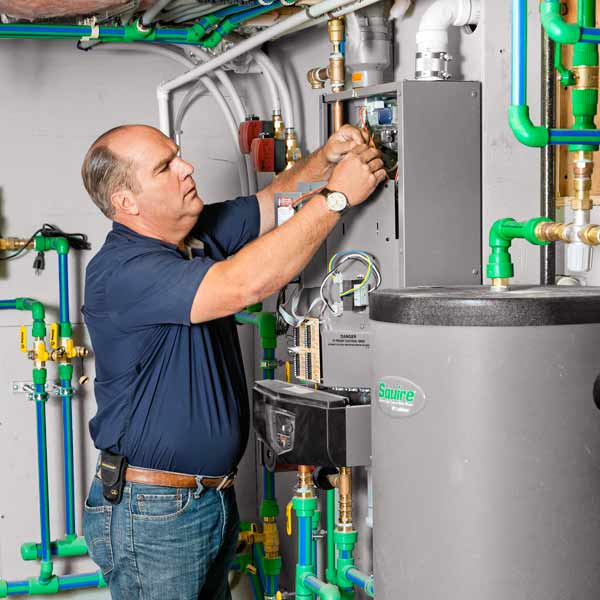 Richard Trethewey setting up HVAC system for slashing energy costs