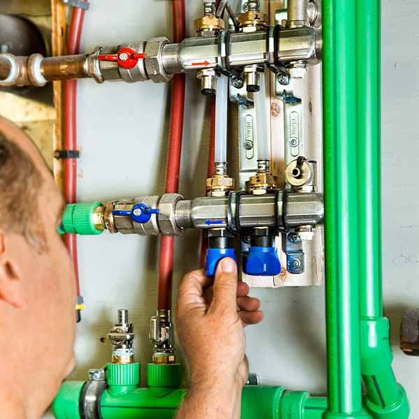 Richard Trethewey setting up HVAC system for slashing energy costs