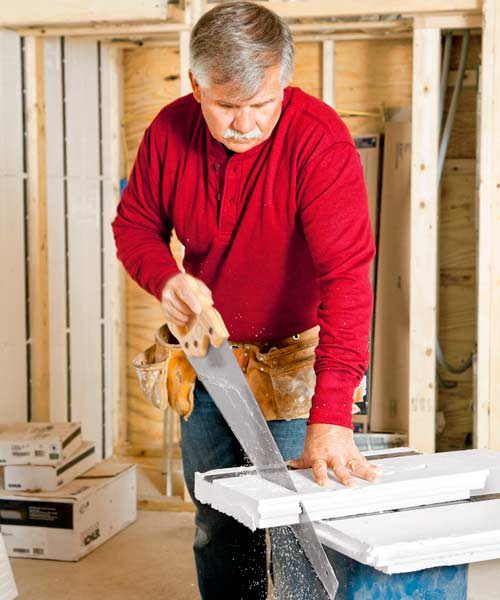 Tom Silva cutting framing and insulation panels for basement for slashing energy costs