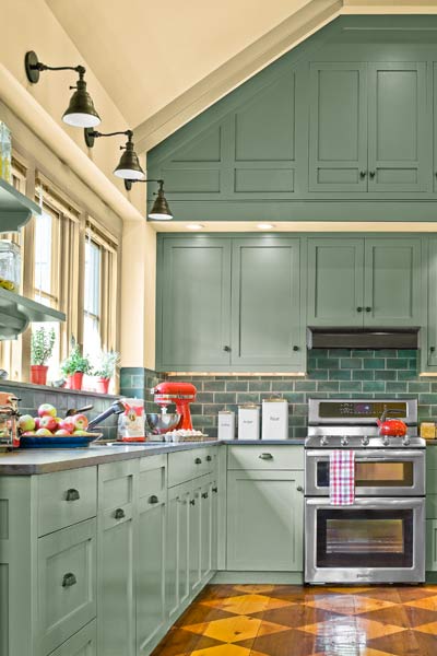 whole-house farmhouse remodel after kitchen with vaulted cathedral ceiling and wall cabinets in open floor plan