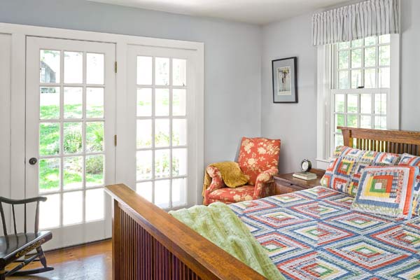 whole-house farmhouse remodel after master bedroom with French doors