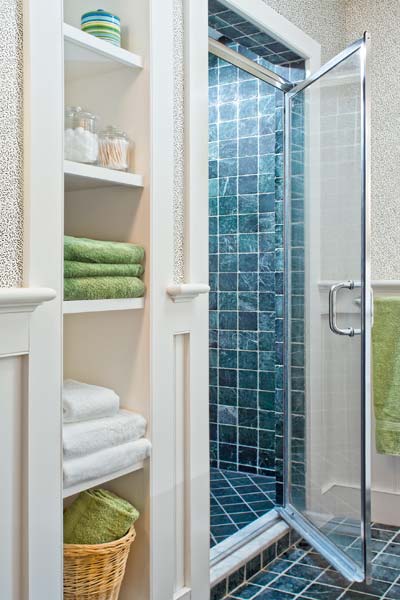 whole-house farmhouse remodel after shower with open shelving for towels in bathroom