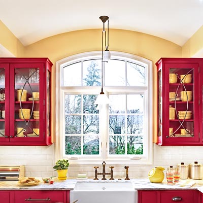 family in red and white kitchen with Shaker-style flat-panel cabinets 