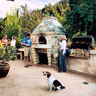 pizza oven with custom hearth in outdoor kitchen