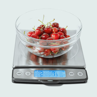 OXO food scale with glass bowl of cherries 