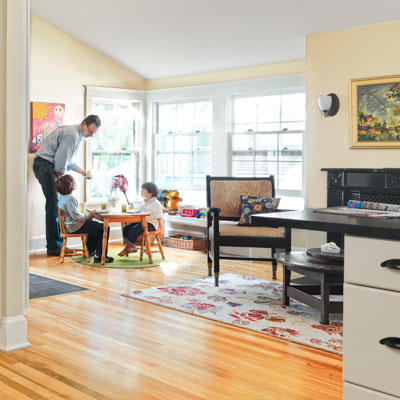 kitchen remodel after with kids' table in corner of area