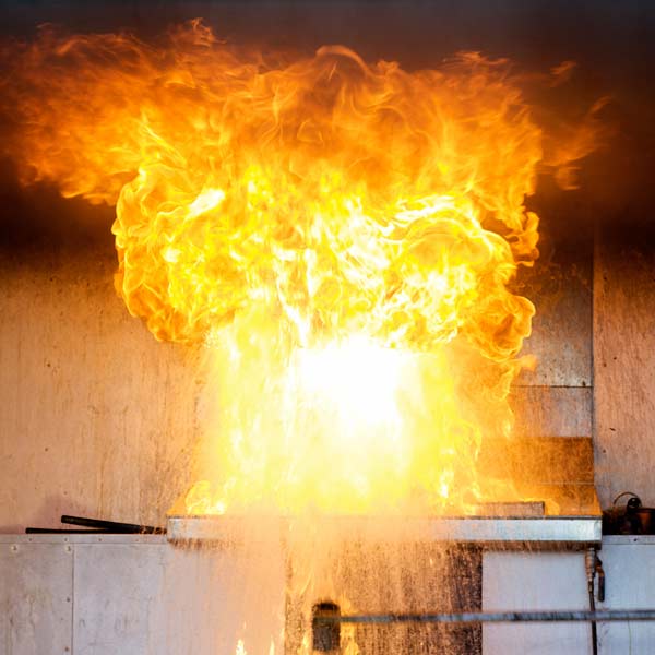 flames from cooking fire traveling to and spreading along ceiling of kitchen