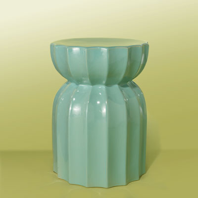 an aqua-blue, fluted ceramic garden stool