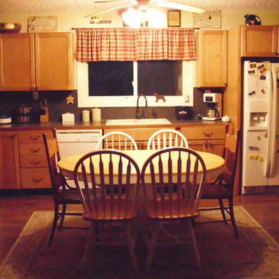 dining room with wood cabinets and table
