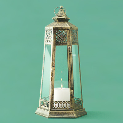 Iron with a patina finish metal candle lantern