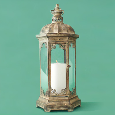 Painted iron with a patina finish metal candle lantern