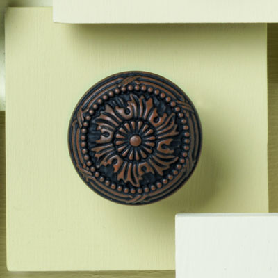 zinc cabinet knob with a ribbon design