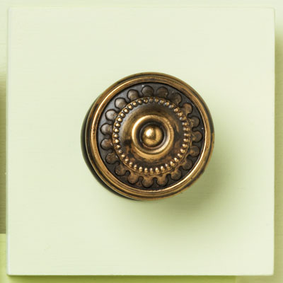 zinc cabinet knob with a bronze beaded design