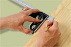 hands using a combination square in a this old house tool test