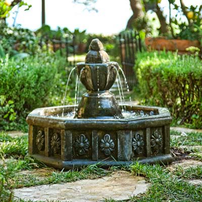 fountain with ocotgonal basin in herb garden 