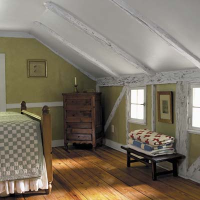 master-bedroom has pine floors and painted and glazed beams