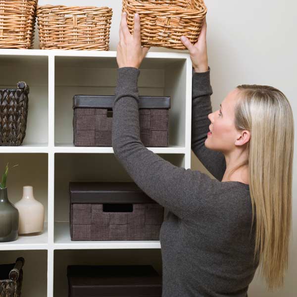 10 uses for weatherstripping women placing boxes on shelves