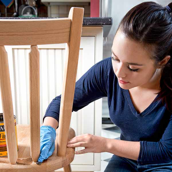 10 uses for weatherstripping spreading stain on chair with felt weather stripping squares