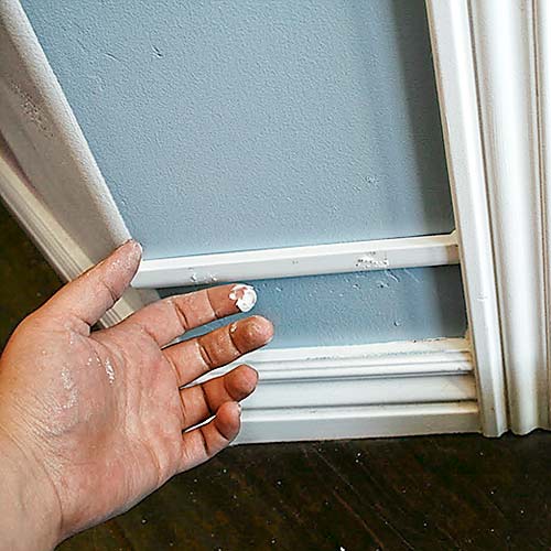 money saving blogger DIY project beefed up baseboards with bead trim step 2