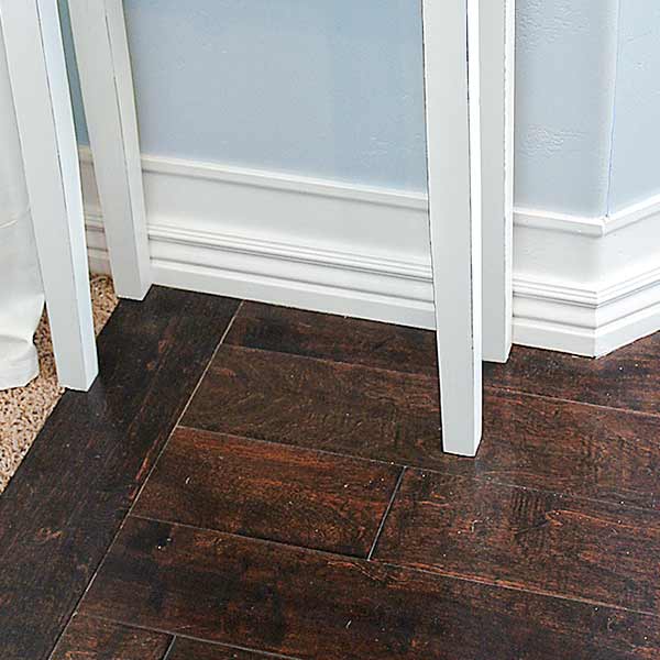 money saving blogger DIY project beefed up baseboards with bead trim step 3