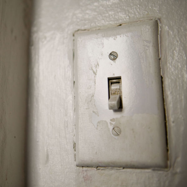 outlet cover with painted-over screws