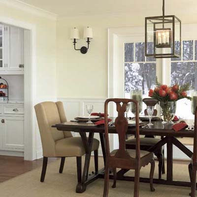 widened passageway between kitchen and dining room in this remodeled shingle-style cottage
