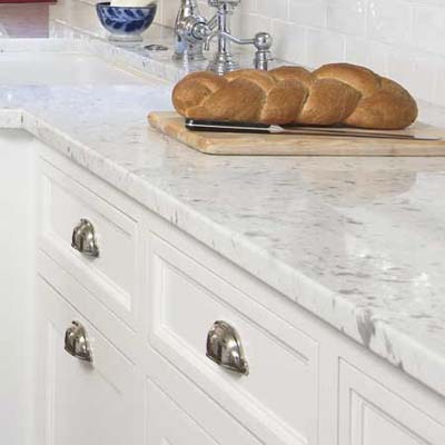 marble counters used in this remodeled shingle-style cottage