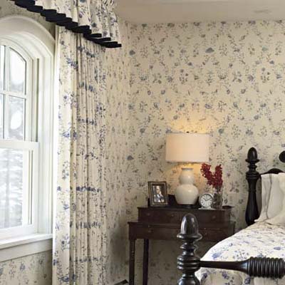 arched windows give an authentic feel to this remodeled shingle-style cottage