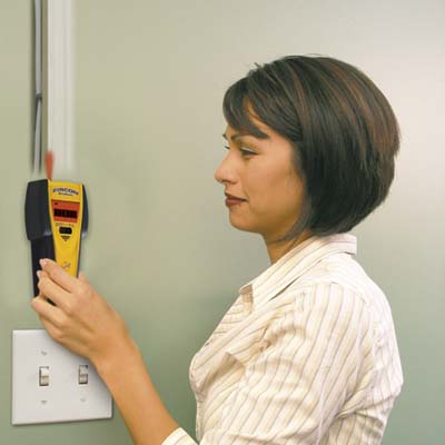 a handheld scanning device for finding studs or joists behind walls, floors and ceilings made by Zircon