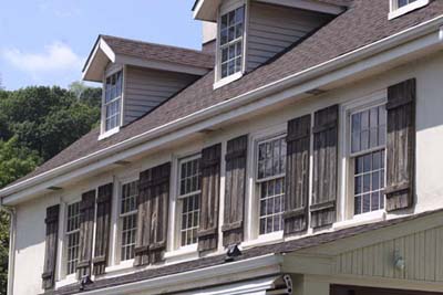 six-over-six double-hung windows in gabled dormers