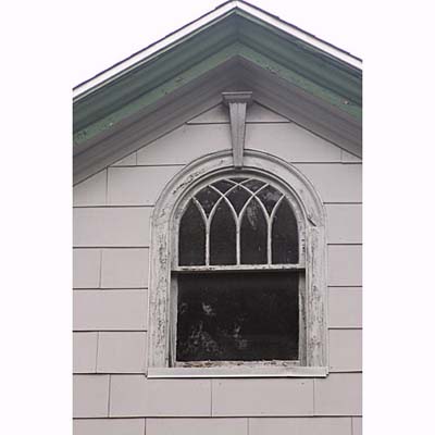 a round headed windows with a missing sill