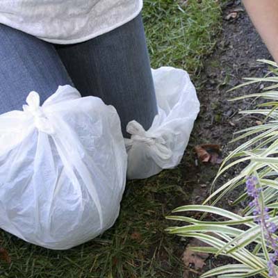 plastic bags wrapped around the knees to protect jeans against dirt