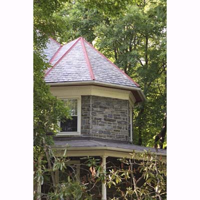 turret with colored ridge caps and valley flashing