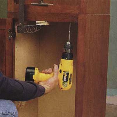 Clamp and join the bookcase to the wall unit with drill