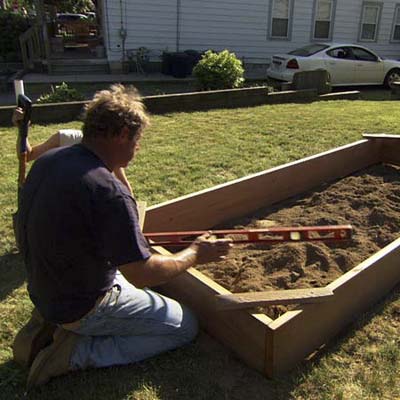 Level the frame | How to Build a Raised Vegetable Garden | This ...