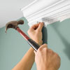 on long runs, place a nail under the molding every few feet and at joints to hold it in place
