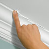 use your finger to smooth out the seams where the molding meets the wall and the ceiling