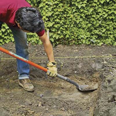 excavate by digging out the topsoil