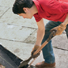Shovel Stone Dust into Trench