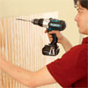 attaching the beadboard panel to the mudroom bench