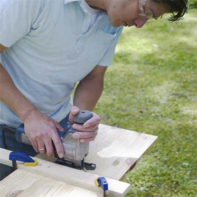 this old house editor mark powers cutting wood to build a pet eating station