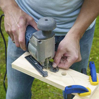 this old house editor mark powers cutting the tray handles out of a board